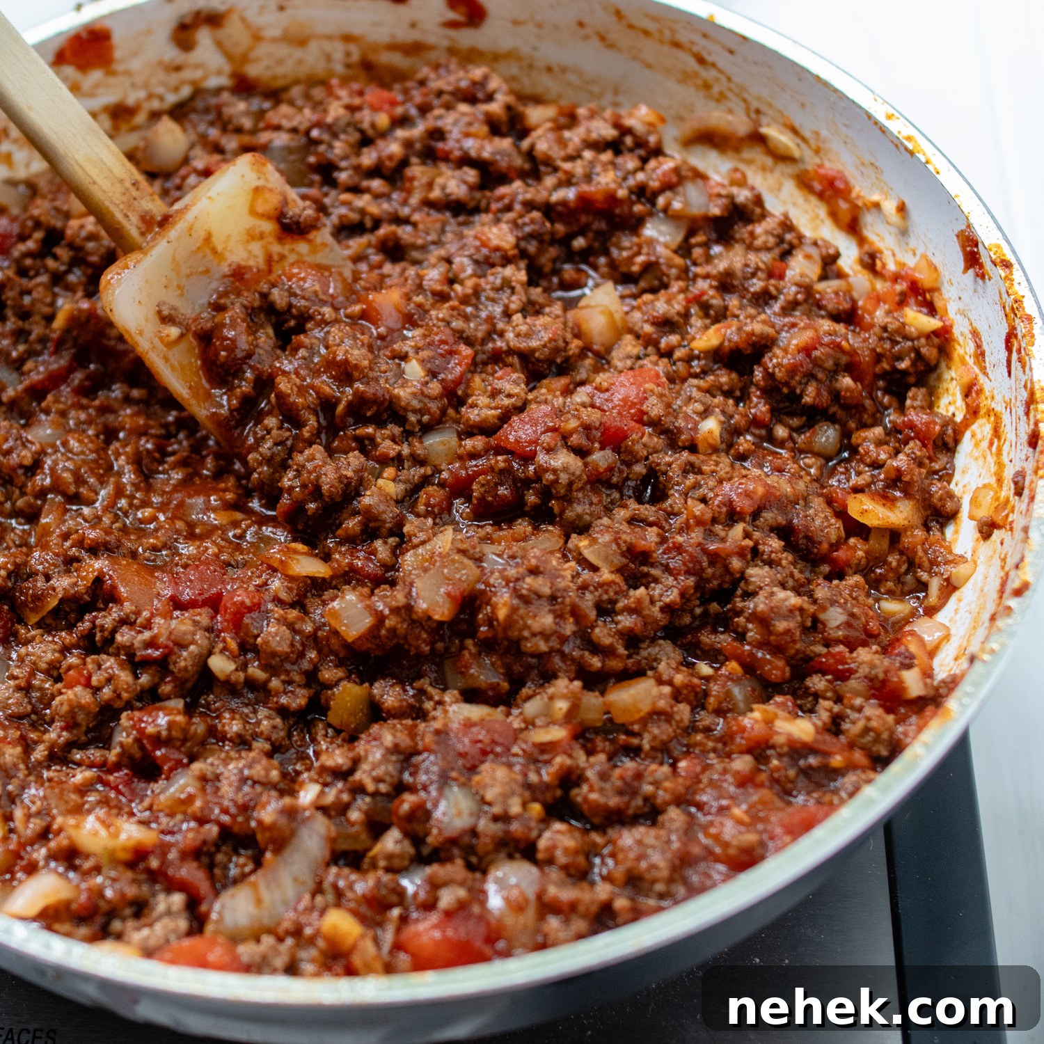 Sweet and Spicy Sloppy Joe Tacos with Lime Sour Cream 6 the taco meat in a skillet with sloppy joe sauce.