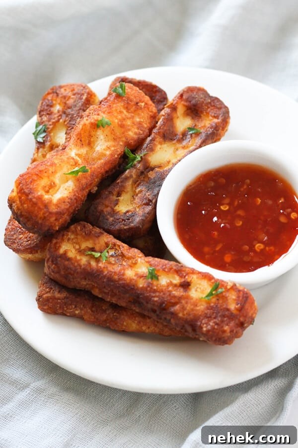 a plate of halloumi fries with sweet chilli sauce.