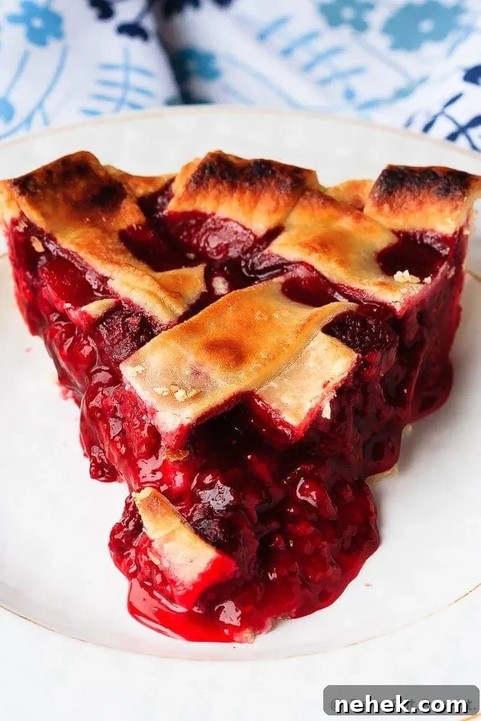 Raspberry Pie - Easy to make raspberry pie can be made with either fresh or frozen raspberries. This is the perfect dessert - tart, sweet, perfect raspberry pie!
