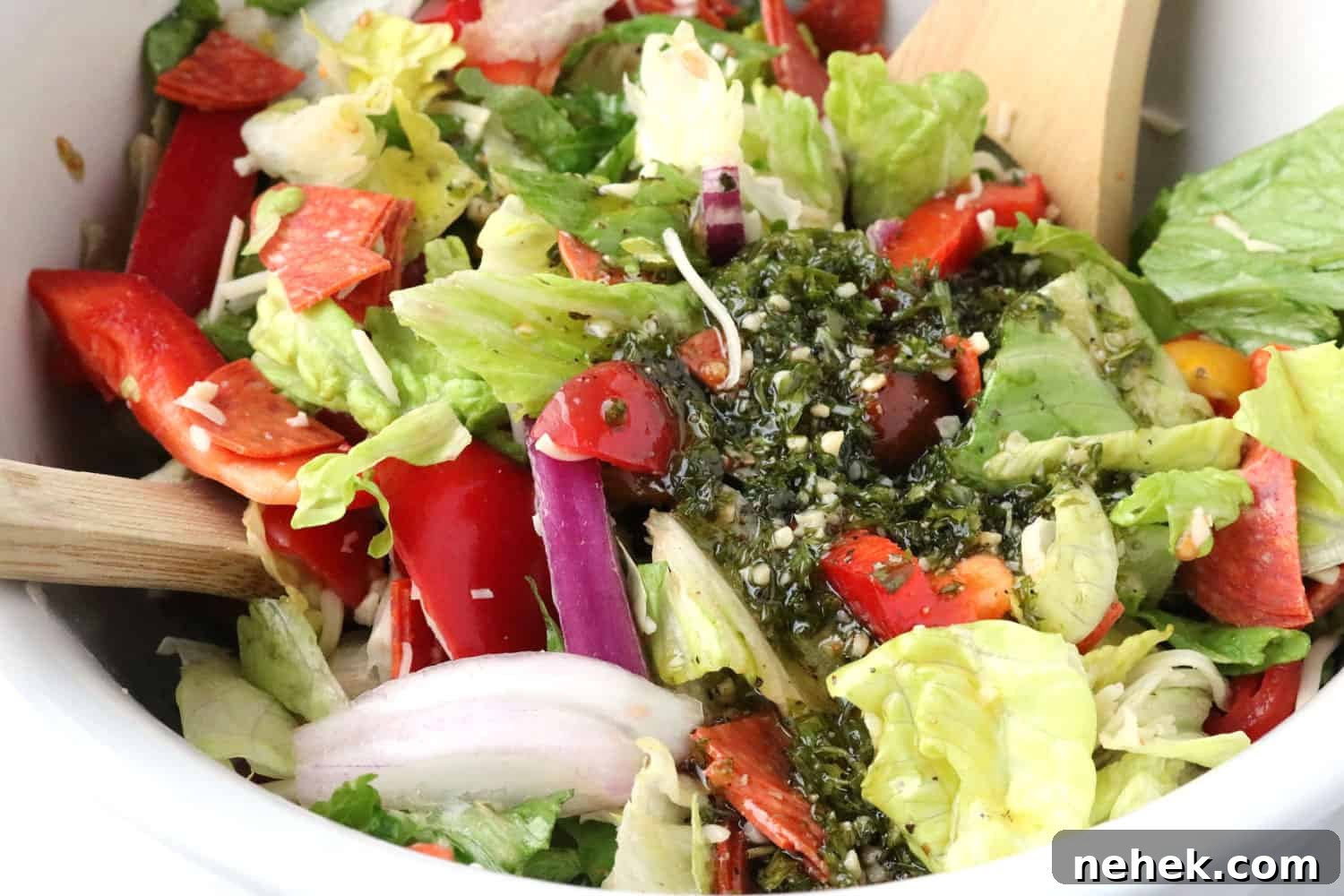 Classic Italian Salad with Homemade Dressing Recipe 5 close-up of Italian salad with homemade Italian dressing poured on top.