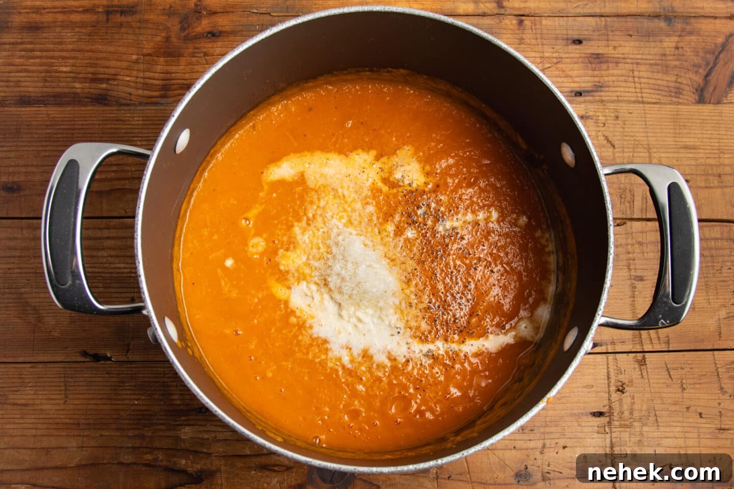 Roasted Tomato and Butternut Squash Soup Recipe 10 This is a picture of the blended soup with cream, parmesan and spices added.