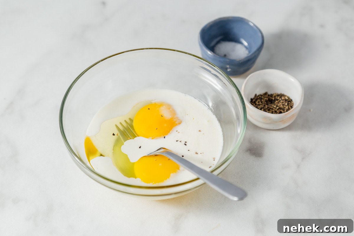mixing eggs with cream, salt and pepper.