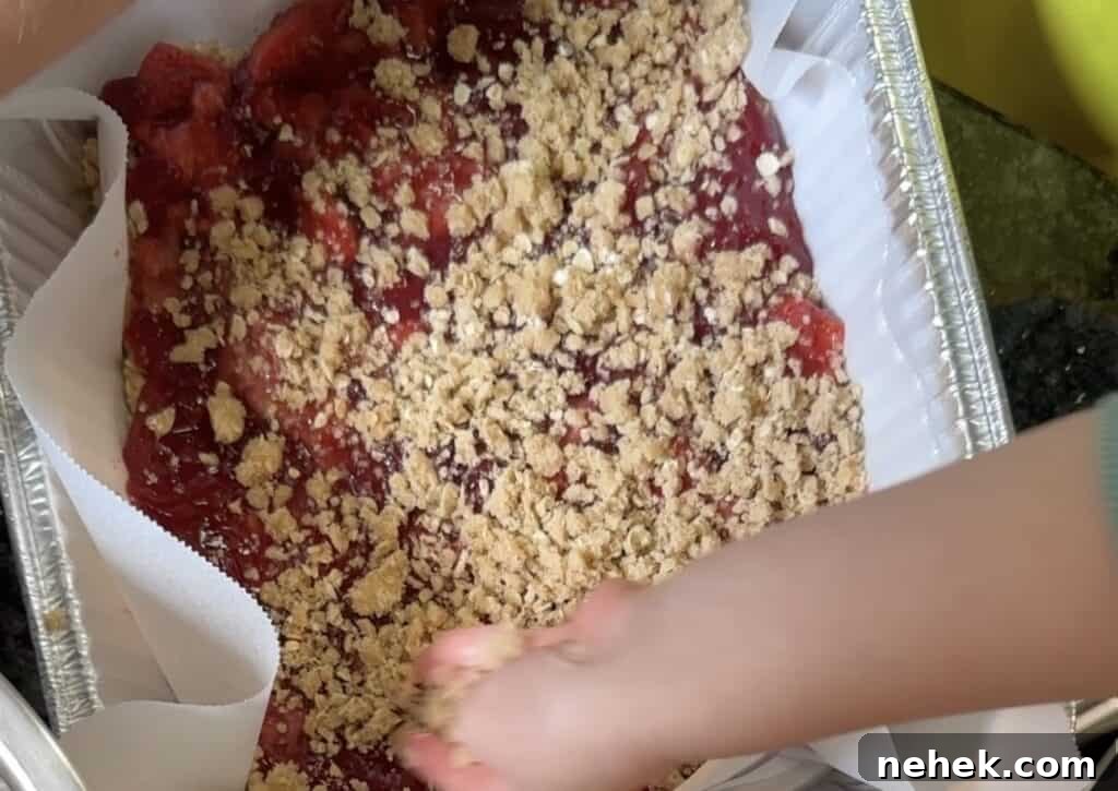 little hands helping with the crumb topping