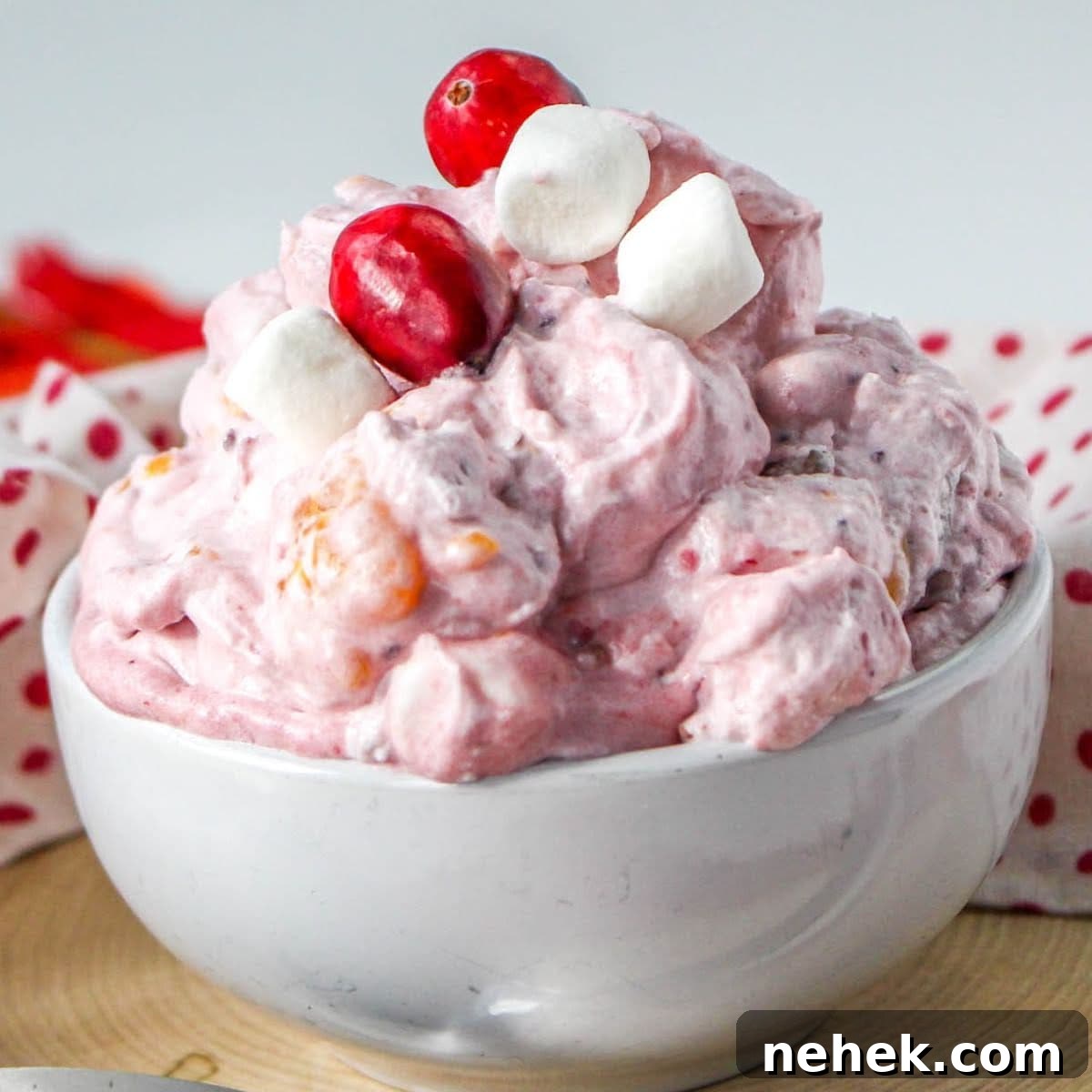 cranberry orange fluff salad in a white bowl