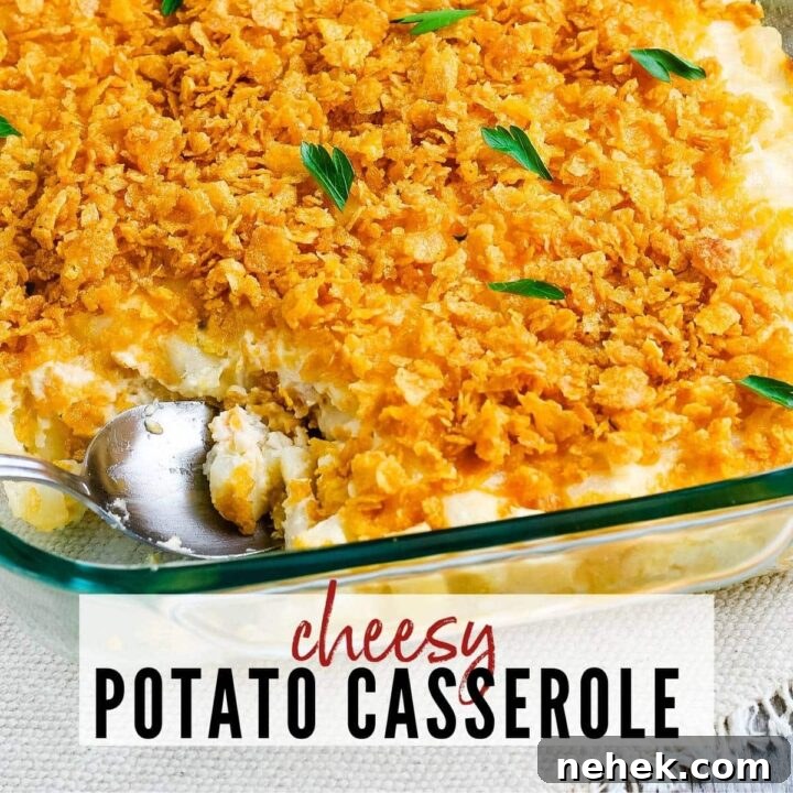 cheesy potatoes with cornflake topping in a glass baking dish