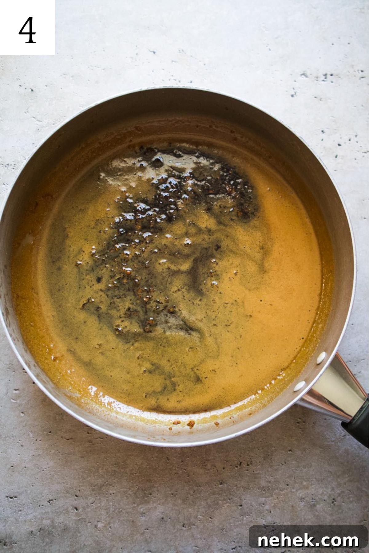 skillet with honey ginger sauce simmered down.