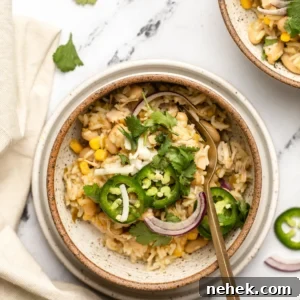 white bean casserole in a bowl with a spoon