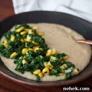 savory oats with spinach and corn in a bowl