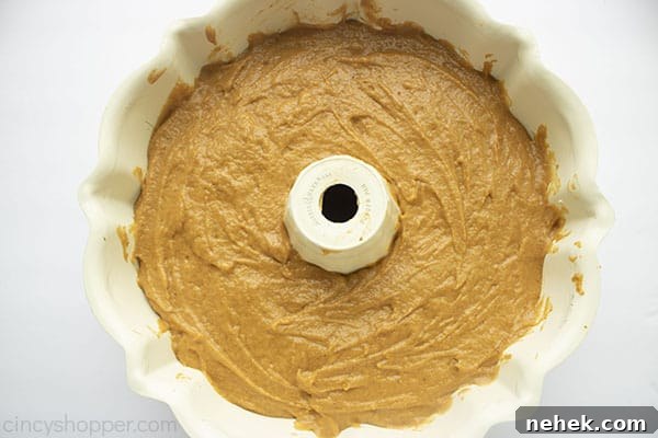 Pumpkin cake layer added over the top of cream cheese layer.