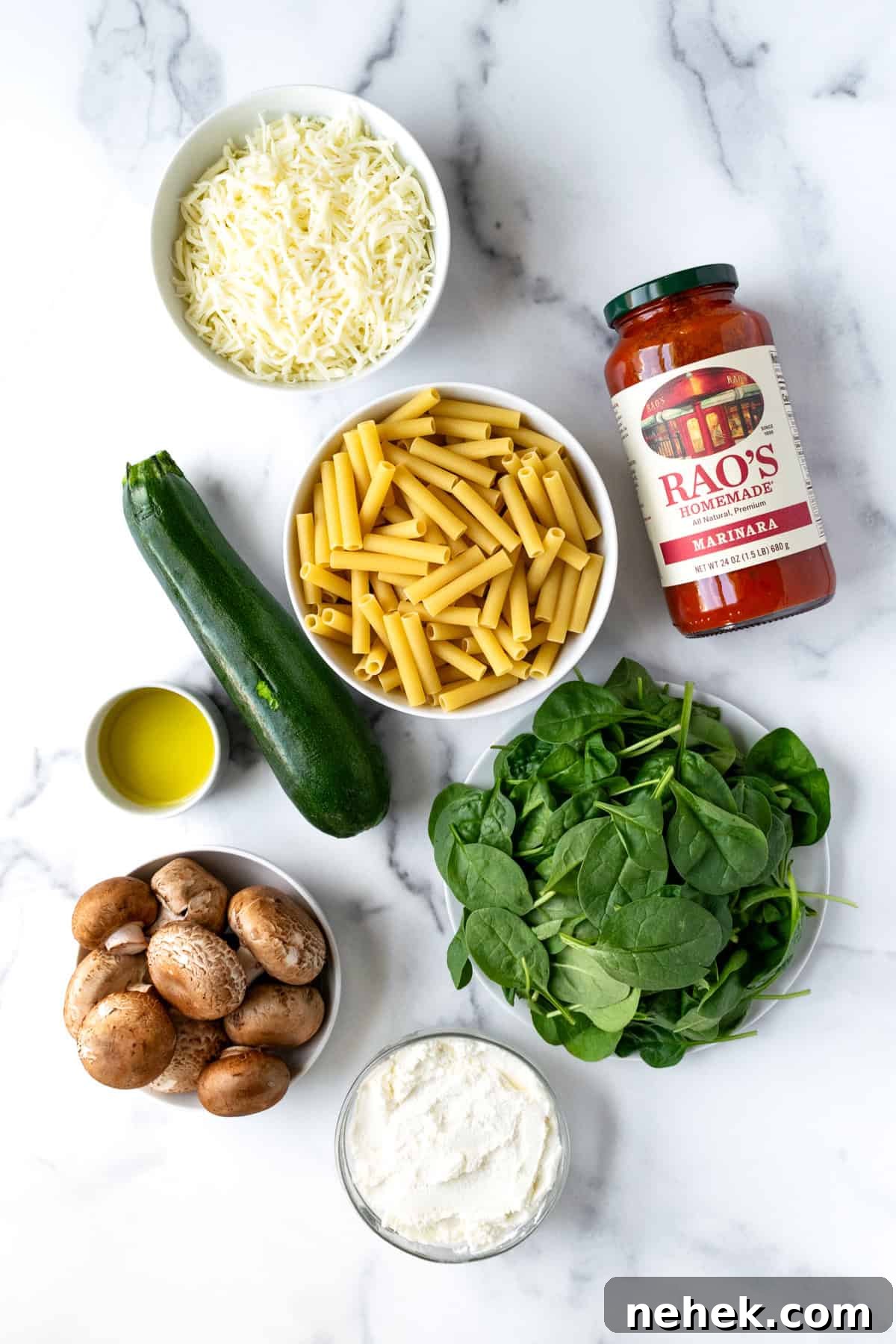 Cheesy Vegetable Baked Ziti with Roasted Tomatoes and Spinach 3 Vegetable Baked Ziti Ingredients on a marble countertop.