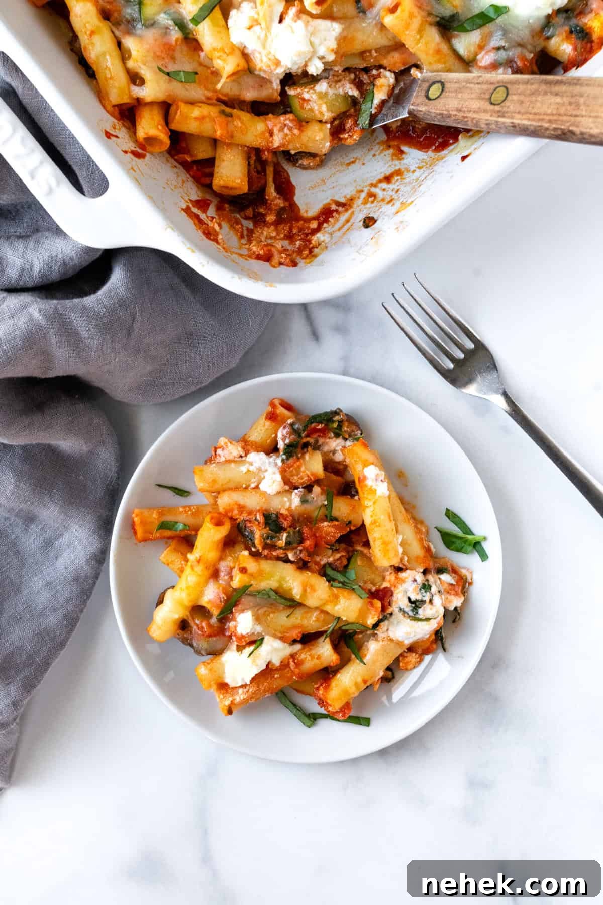 Cheesy Vegetable Baked Ziti with Roasted Tomatoes and Spinach 9 Meatless Baked Ziti on a white plate.
