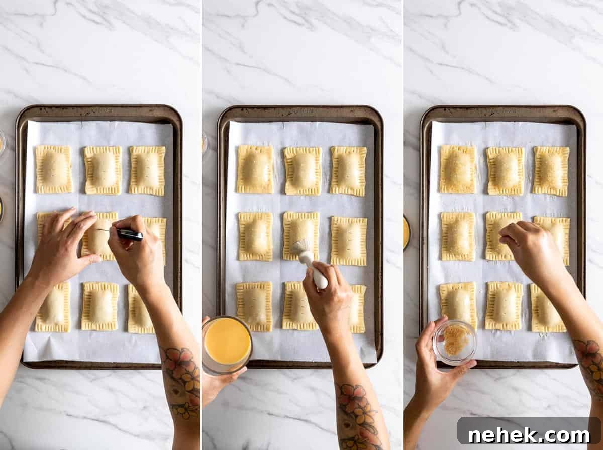 Adding egg wash and turbinado sugar on top of pop tarts before baking.