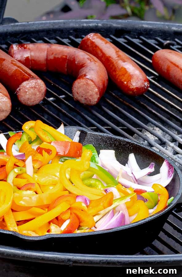 Grilled Sausage with Peppers and Onions on a barbecue grill