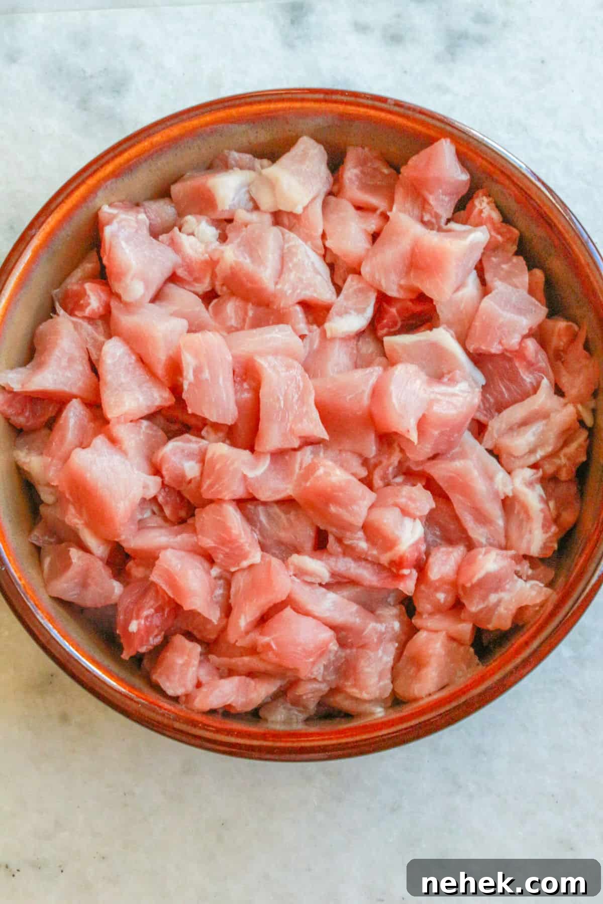 Diced pork in a large bowl