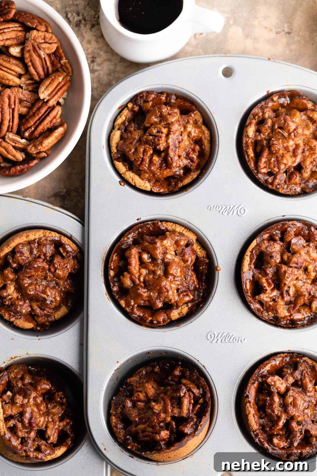 mini pecan pies in baking dish