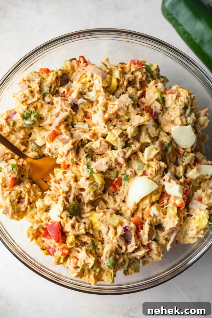 Bowl of finished Spicy Tuna Salad with fork in it. 