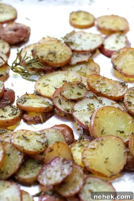 Crispy Potato Flatbread Recipe: Step-by-Step Homemade Guide 5 Photo of thinly sliced roasted potatoes with rosemary.
