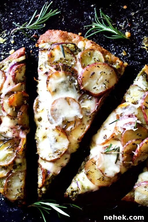 Crispy Potato Flatbread Recipe: Step-by-Step Homemade Guide 9 Close-up photo of a slice of Naan Potato Pizza with Radish Pesto and Smoked Mozzarella.