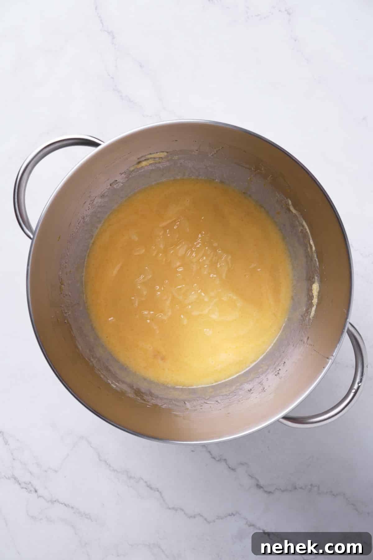 mixing sugar with fats in a mixing bowl for the creaming method.