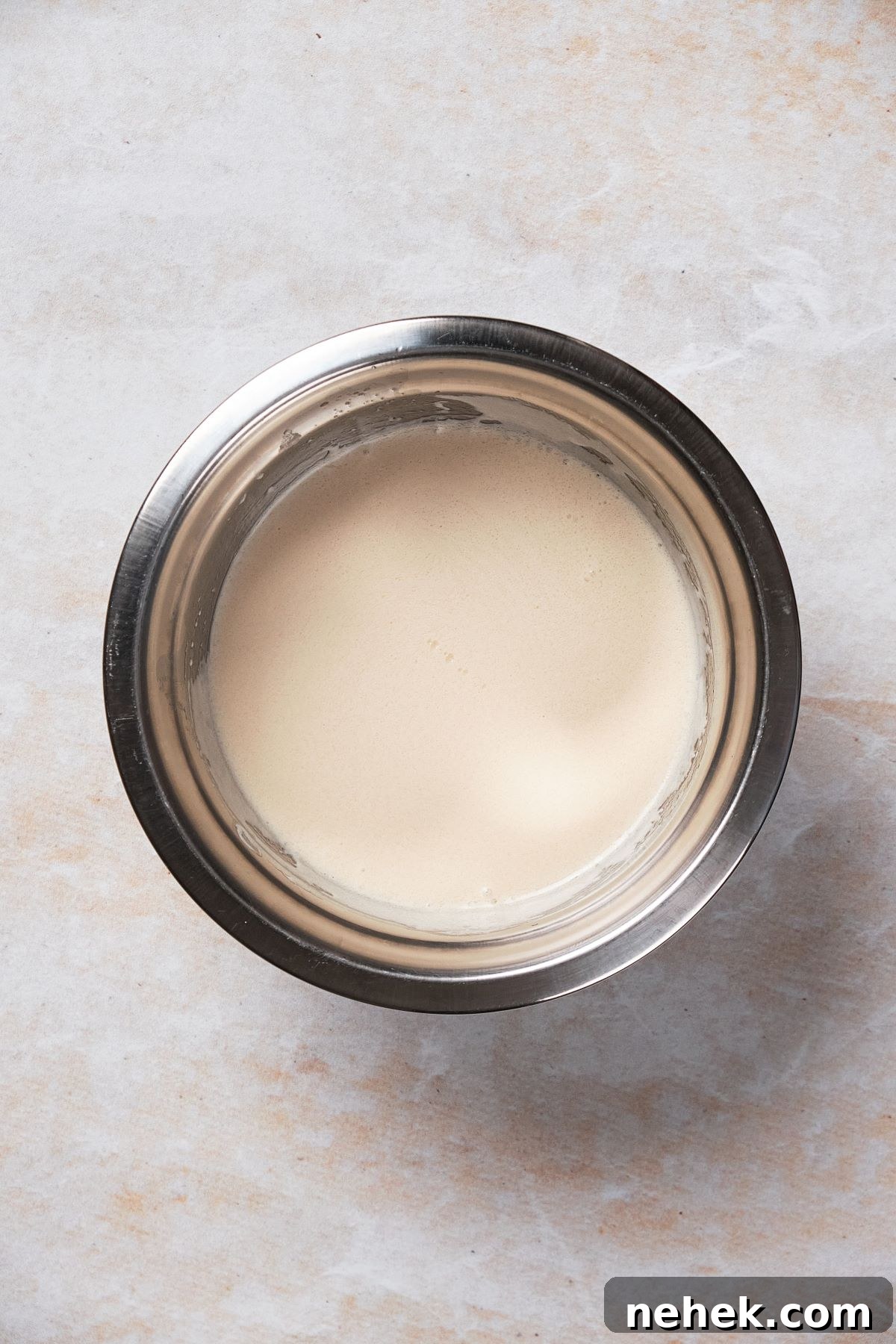 a mixing bowl of liquids set to the side to use the reverse creaming method.