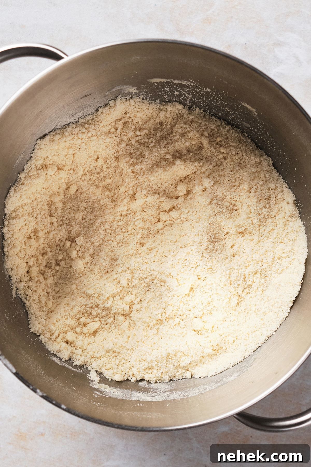 a mixture of flour and butter that resembles sand to demonstrate the reverse creaming method.