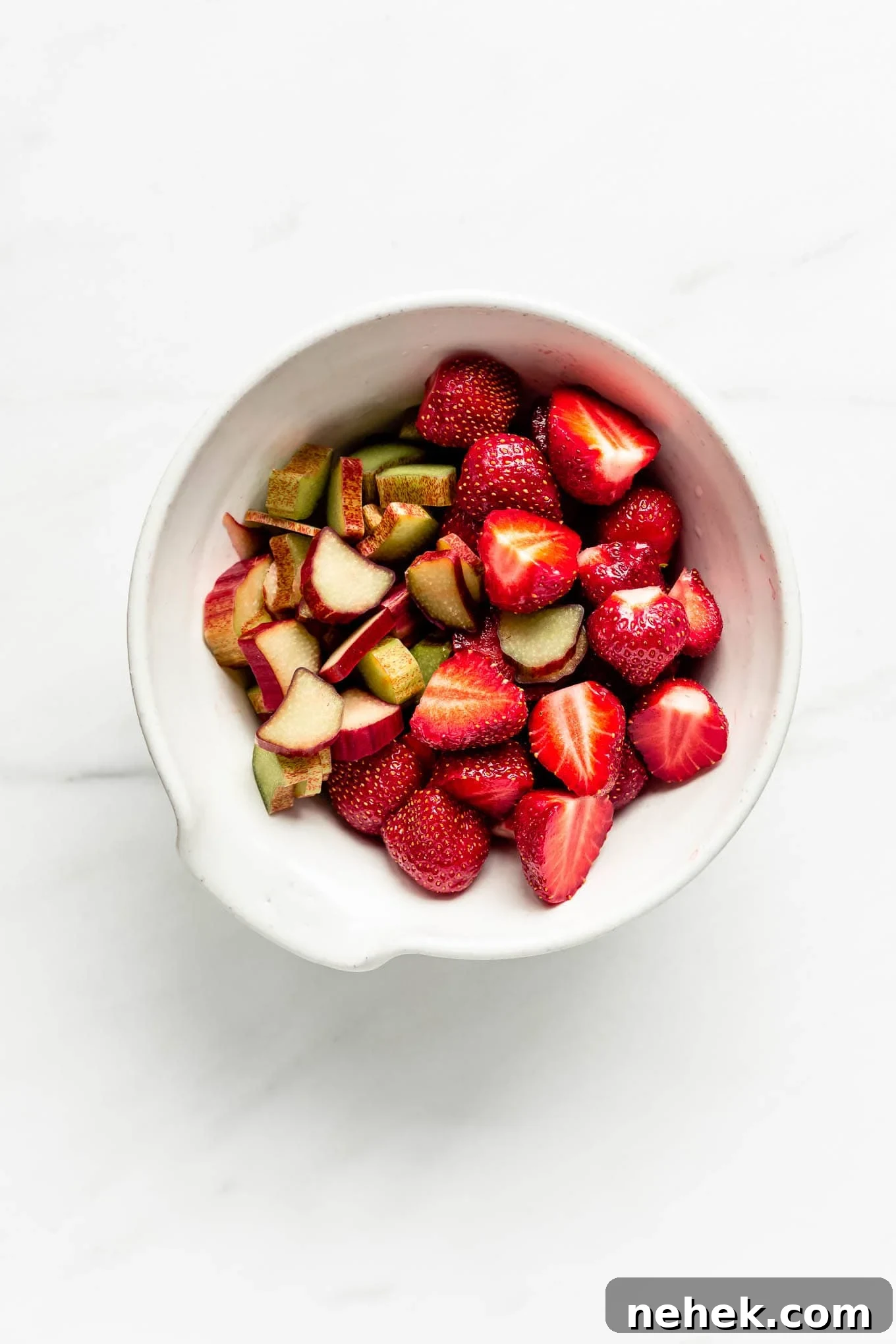 strawberries and rhubarb in a bowl.