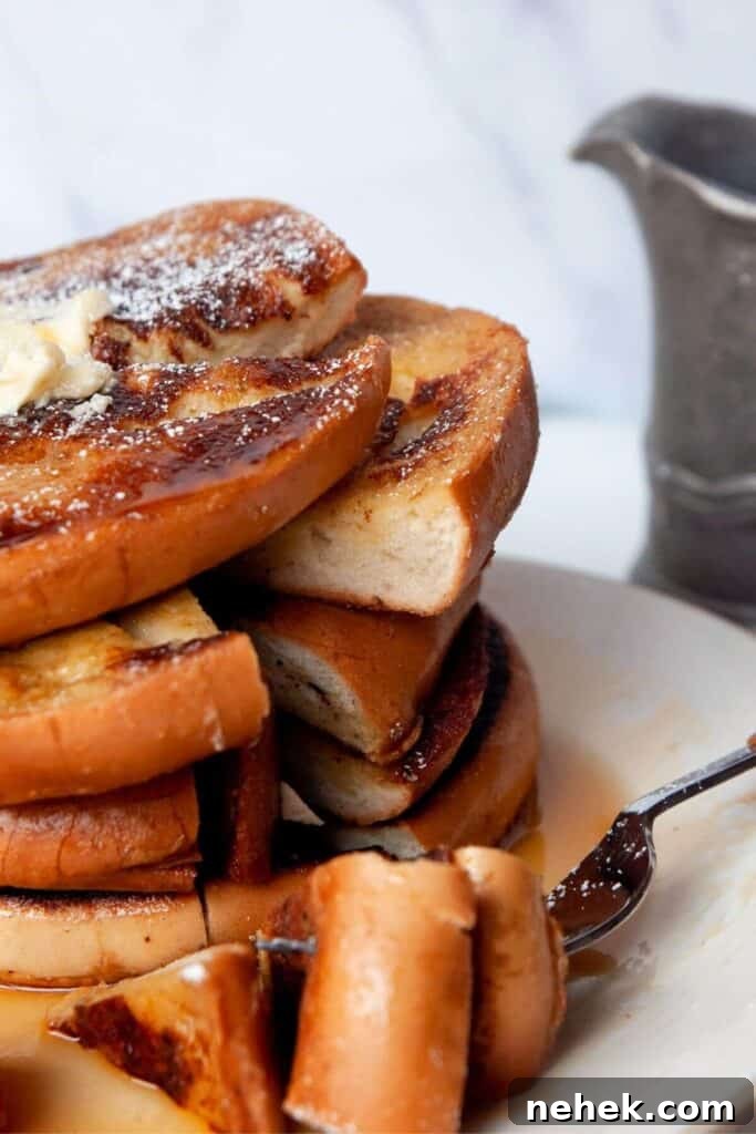 Cinnamon French Toast Bagels with Maple Glaze 10 cutting into French toast bagels