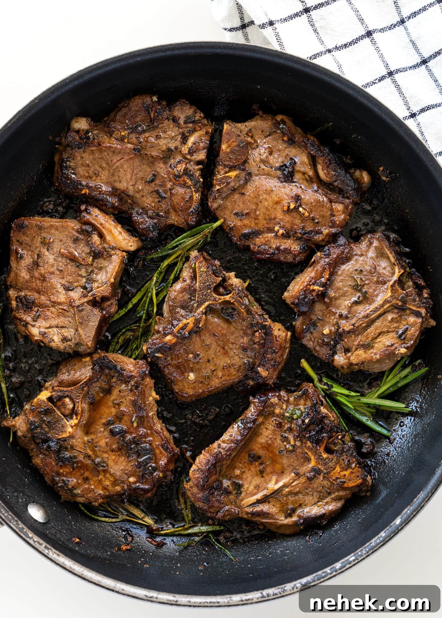 Crispy Pan-Seared Lamb Chops with Garlic Herb Butter 3 Lamb chops marinated mediterranean style and seared on a heavy black pan