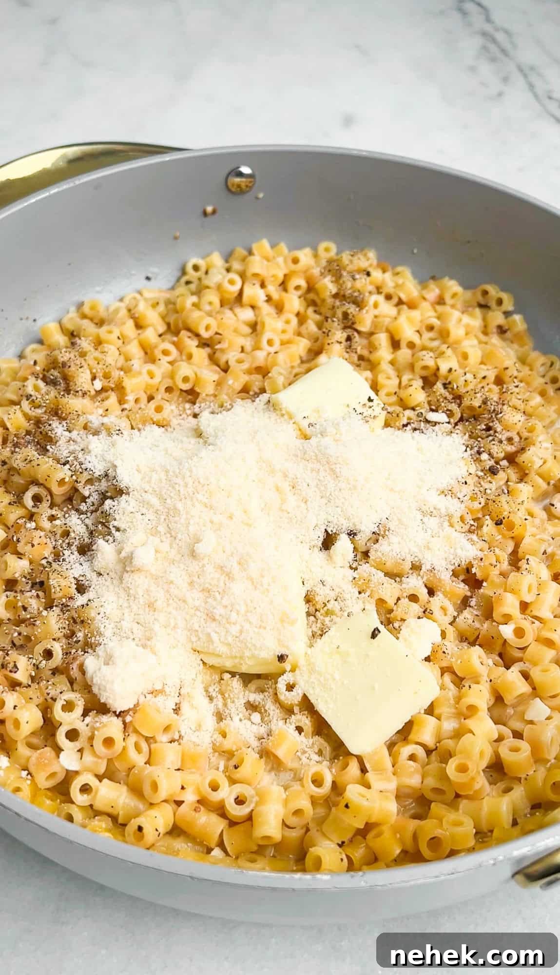 butter and parmesan in to the pan with pasta