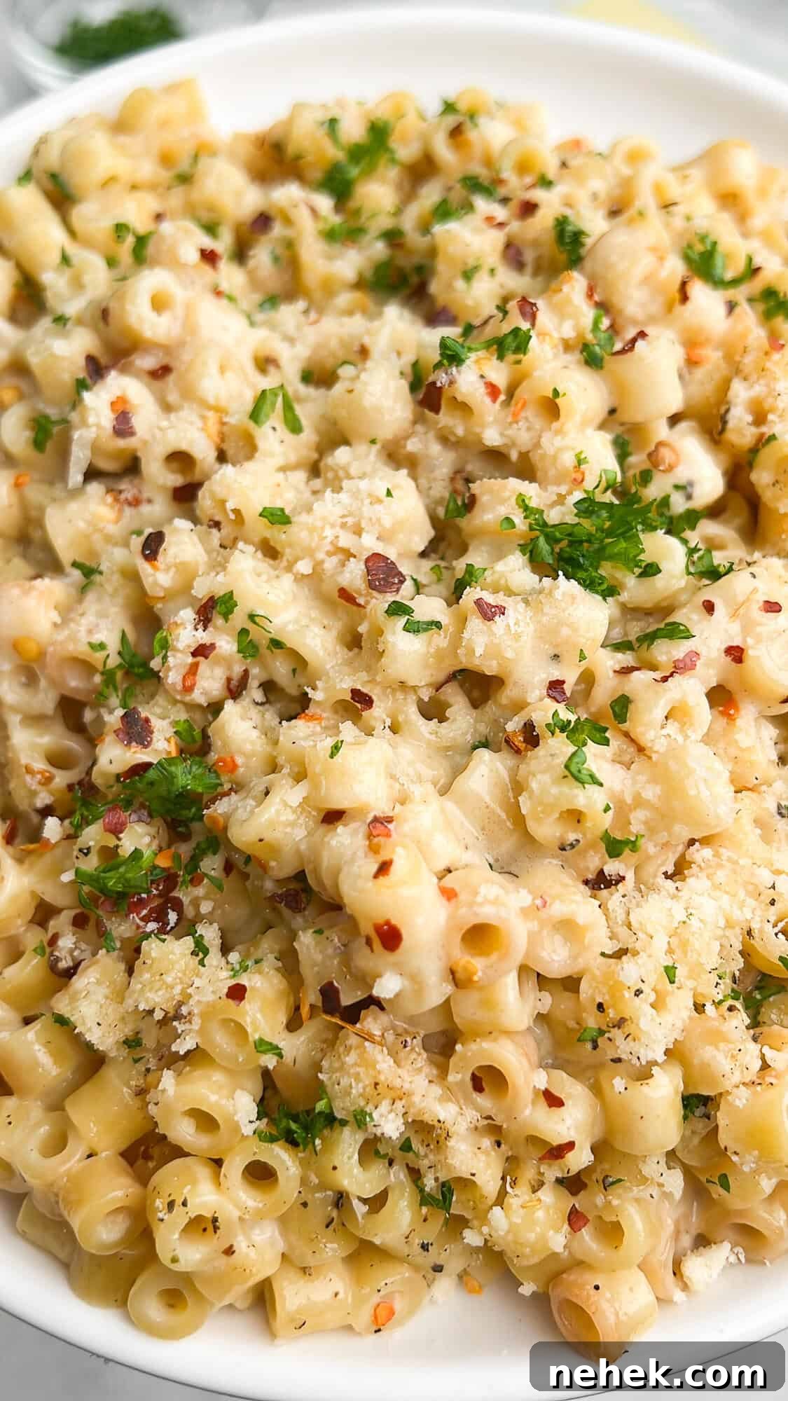 pasta on a plate topped with parsley