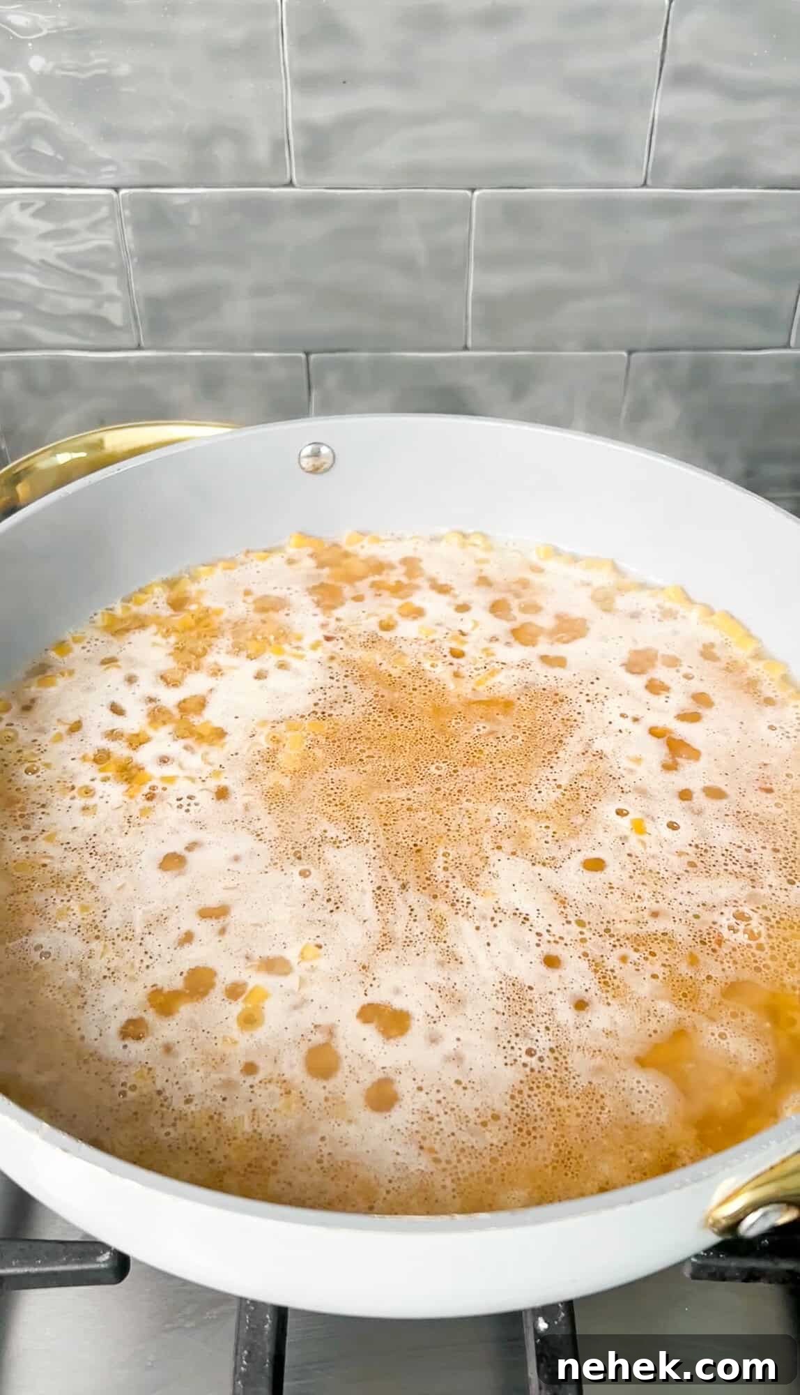 boiling chicken broth in a pan