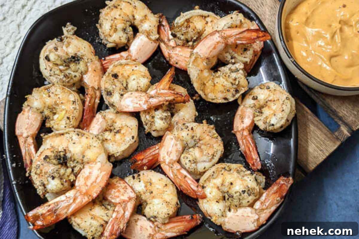 Air Fryer Recipes That’ll Stay on Your Menu Forever 2 Delicious garlic butter shrimp served on a plate