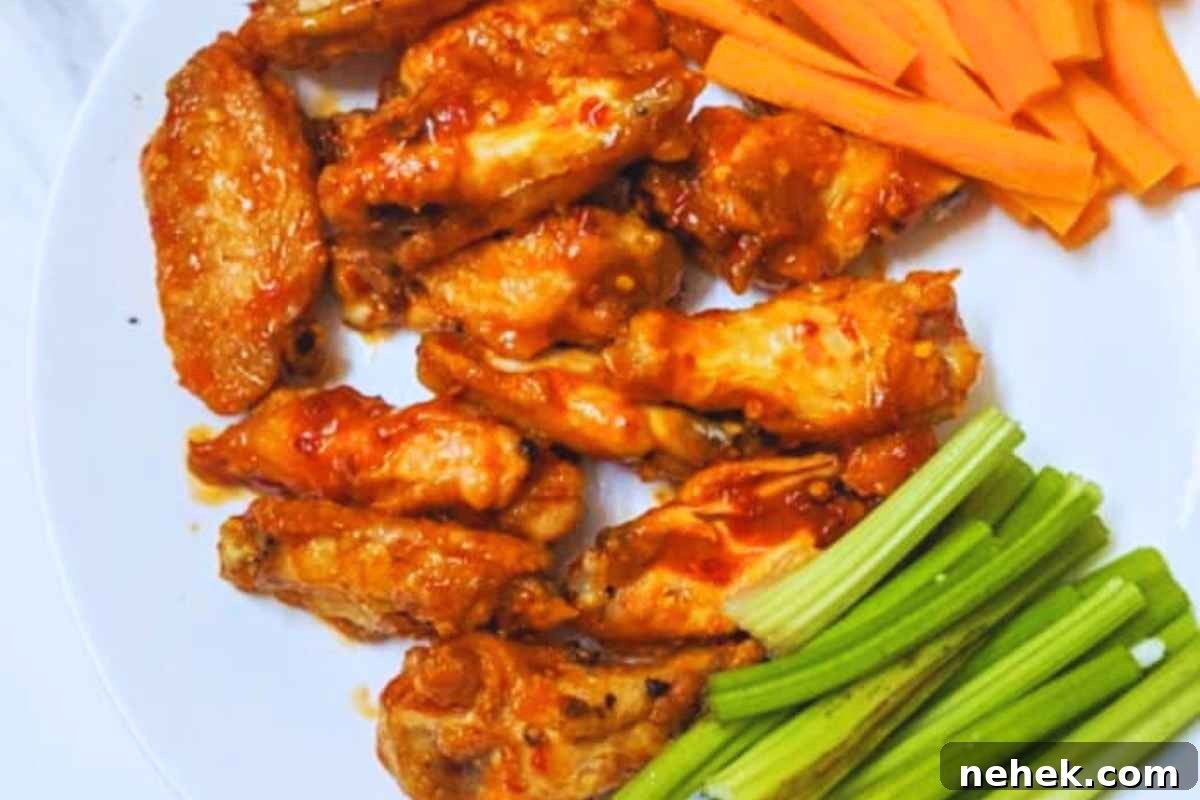 Air Fryer Recipes That’ll Stay on Your Menu Forever 12 Buffalo chicken wings on a plate