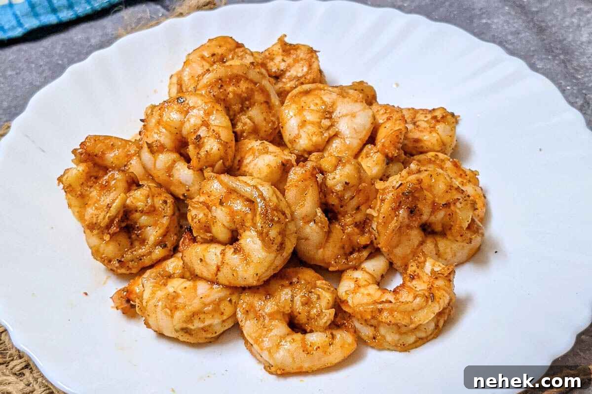 Air Fryer Recipes That’ll Stay on Your Menu Forever 13 Cajun shrimp on a plate