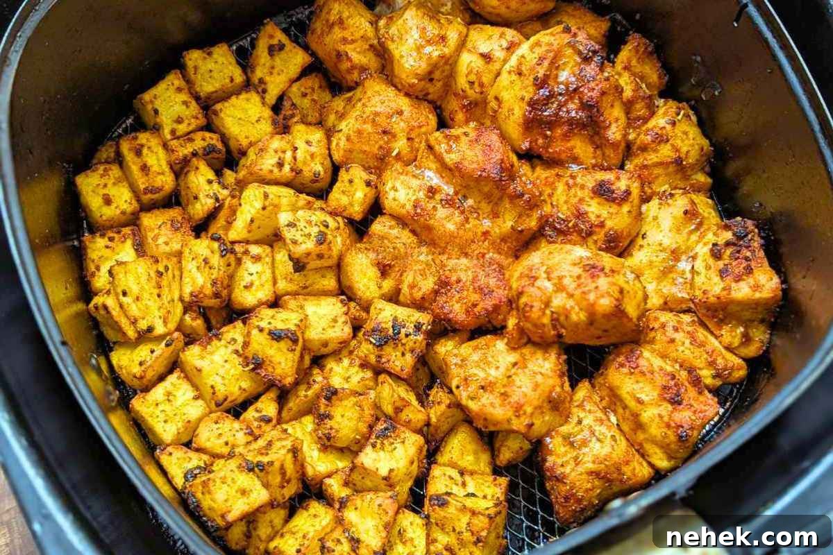 Air Fryer Recipes That’ll Stay on Your Menu Forever 14 Close up of air fryer chicken and potatoes