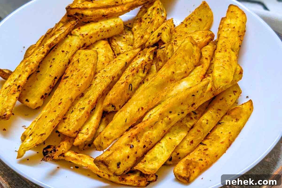Air Fryer Recipes That’ll Stay on Your Menu Forever 16 Sweet potato fries served on a plate