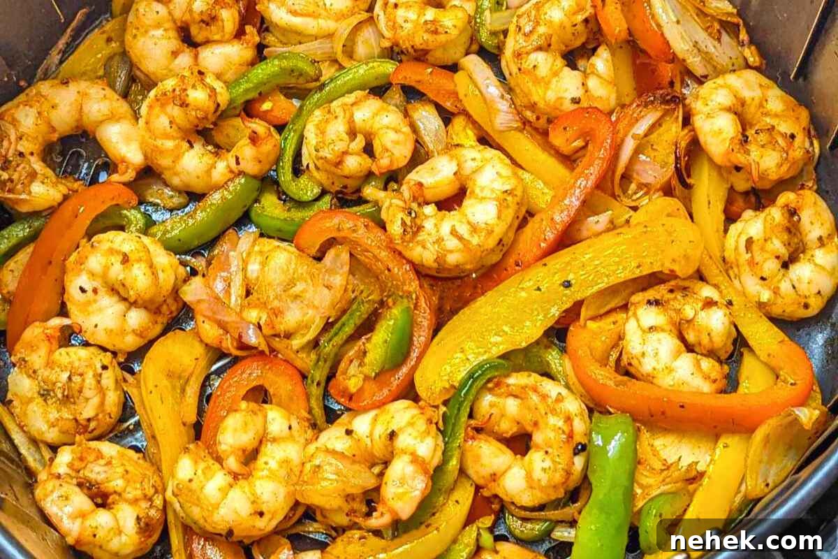 Air Fryer Recipes That’ll Stay on Your Menu Forever 21 Shrimp fajitas in air fryer basket