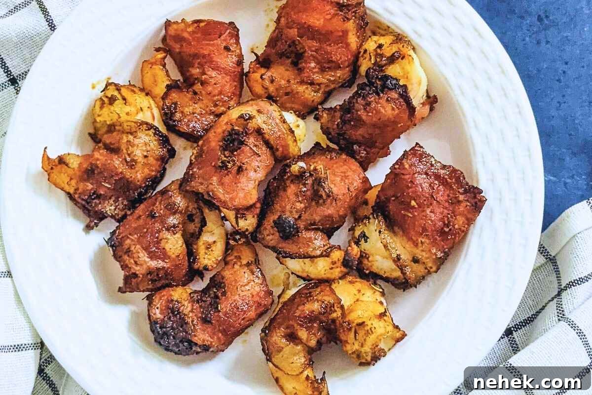 Air Fryer Recipes That’ll Stay on Your Menu Forever 8 Bacon wrapped shrimp on a plate