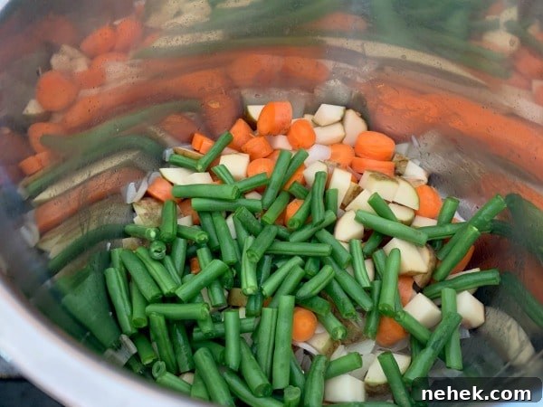 Hearty Gluten-Free Chicken Stew in the Instant Pot 5 Adding the chopped vegetables to the Instant Pot.