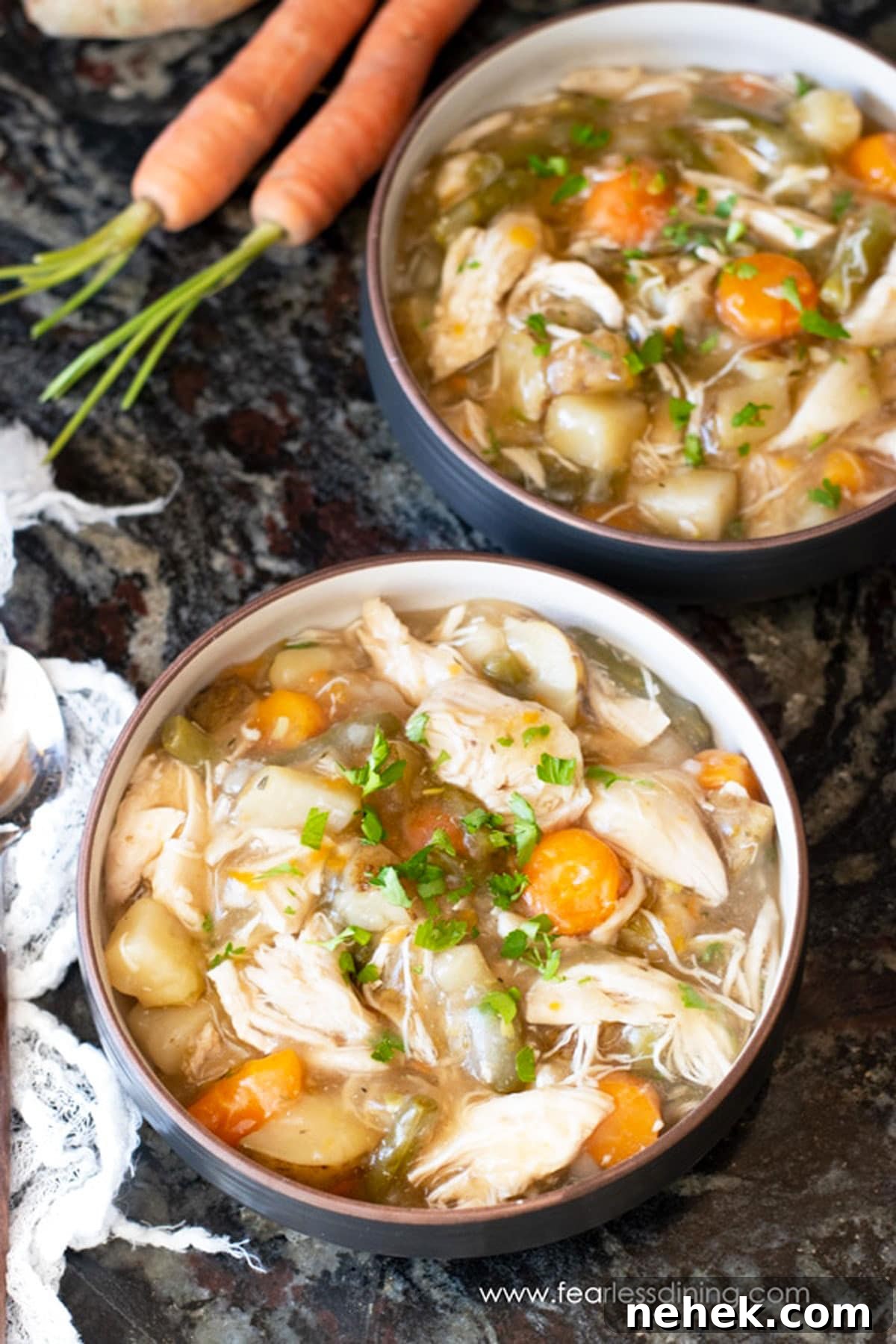 Hearty Gluten-Free Chicken Stew in the Instant Pot 10 Two bowls filled with chicken stew on the counter.