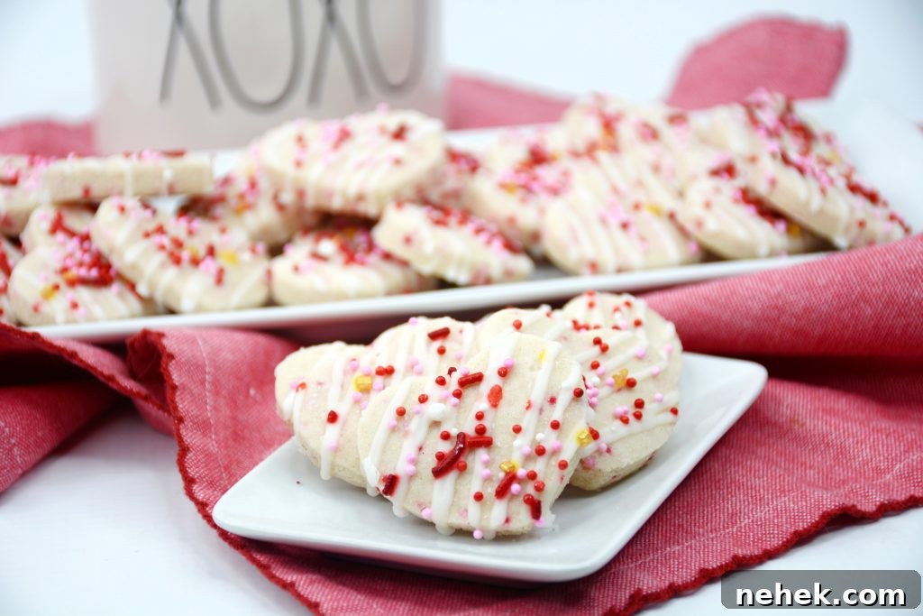 Mini Valentine Shortbread Cookies Recipe for Cute Heart Treats 3 valentine shortbread cookies on a small plate.