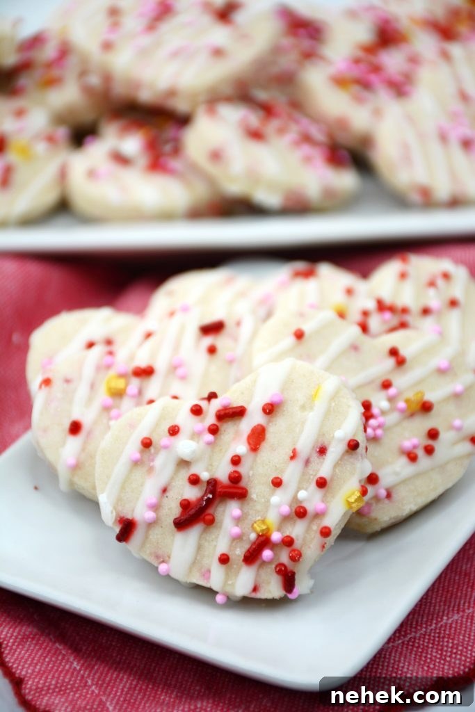 Mini Valentine Shortbread Cookies Recipe for Cute Heart Treats 7 valentine shortbread cookies on a small plate.