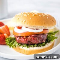 How to Make Smoked Burgers That Stay Juicy and Flavorful 7 close up of a smoked burger on a bun