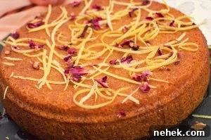 Perfect Lemon Drizzle Cake Recipe — Moist, Zesty Slice 14 The best Lemon drizzle cake with lemon drizzle and rose petals on top perfect for a birthday