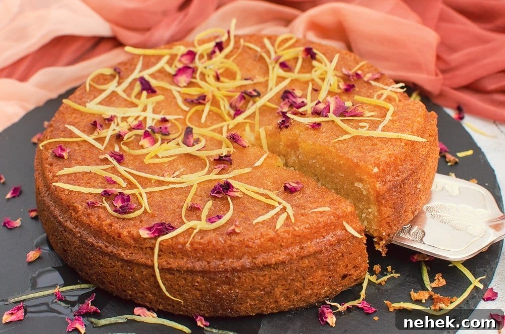 Perfect Lemon Drizzle Cake Recipe — Moist, Zesty Slice 25 Slice of flawless lemon drizzle cake being lifted up with a silver cake knife