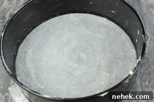 Perfect Lemon Drizzle Cake Recipe — Moist, Zesty Slice 4 Cake tin that has been greased with butter and lined at the bottom with parchment paper