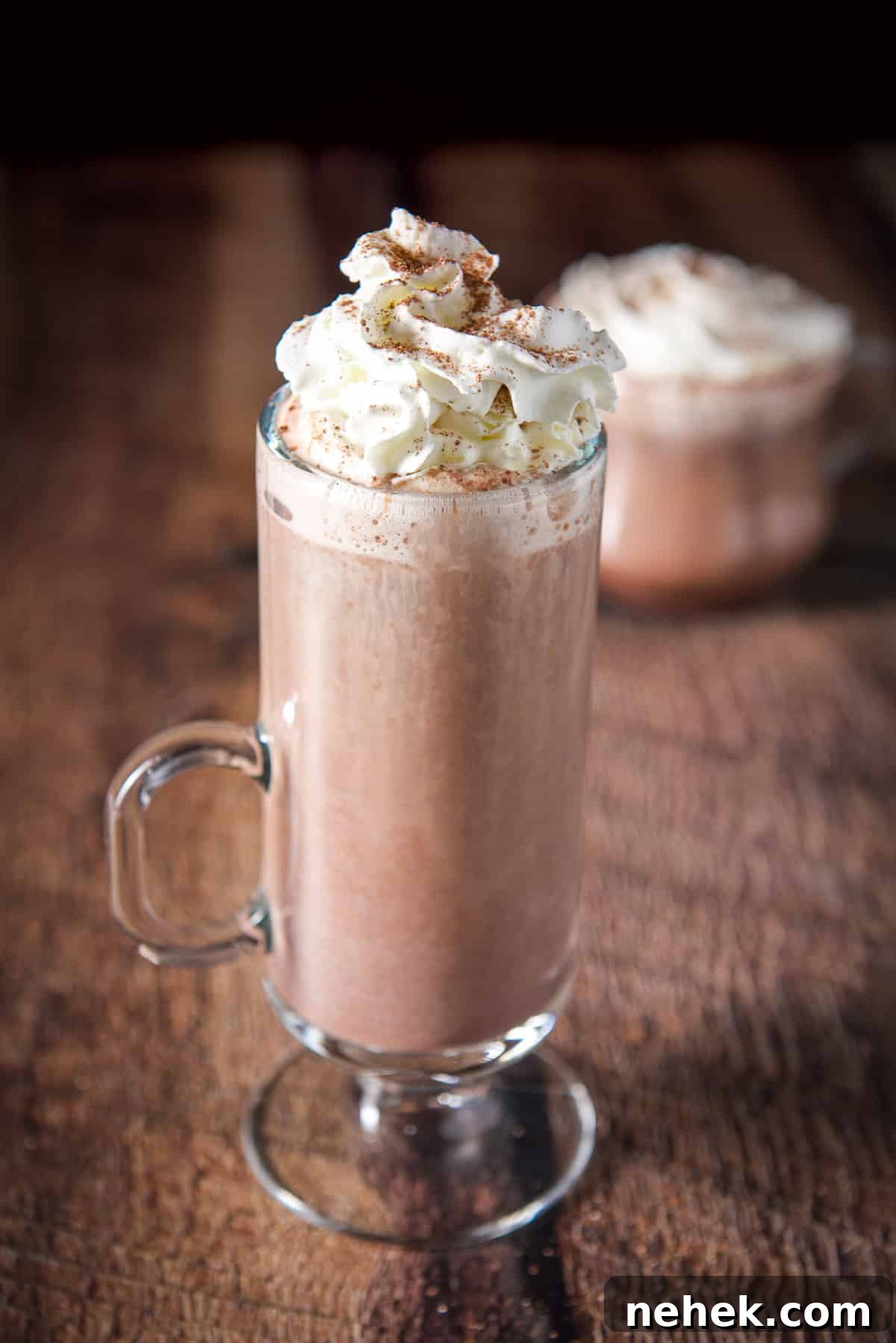 Snow Plow Cocktail Recipe: Creamy Coffee Brunch Cocktail 6 Two mugs with hot chocolate in them with whipped cream and sprinkled chocolate on top