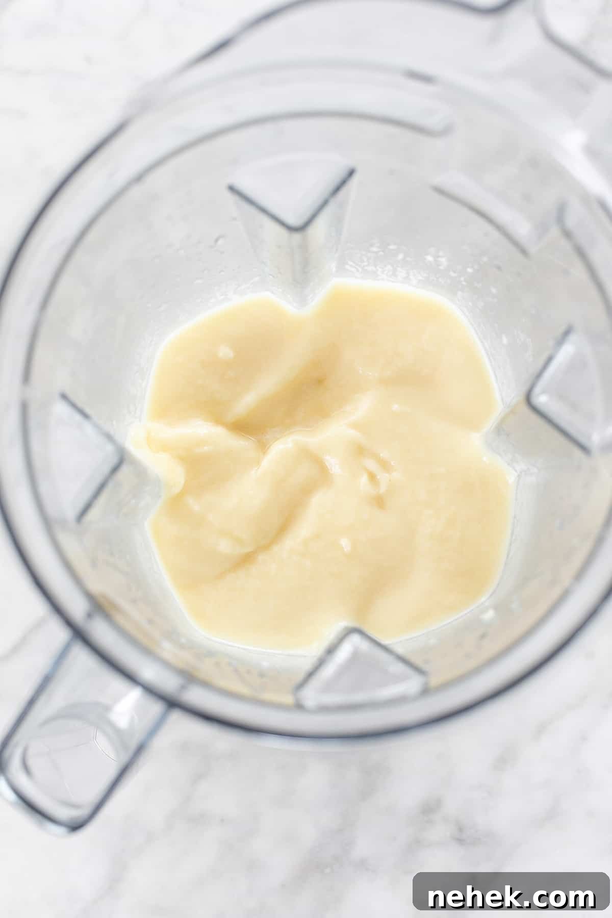 Creamy Non-Alcoholic Piña Colada Recipe 4 blended frozen cocktail - coconut cream, piña colada ingredients, piña colada ingredients, cream of coconut, lime juice, pina coladas