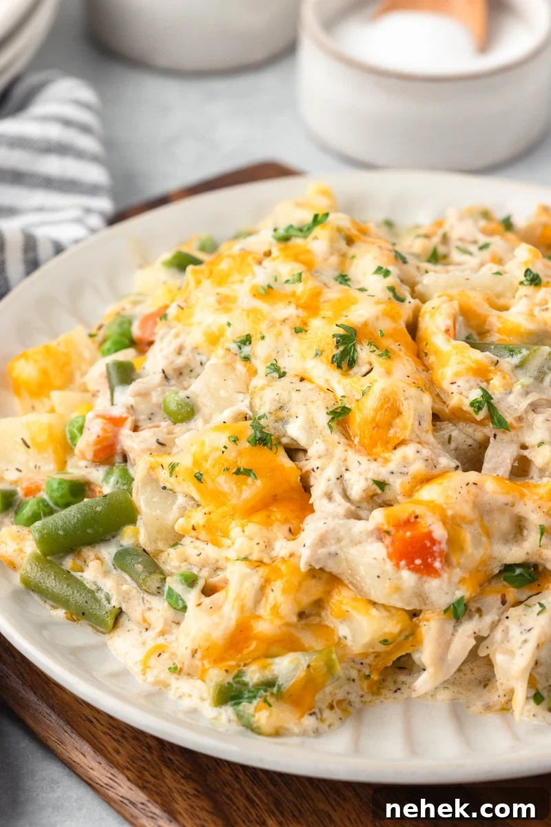 One-Pan Chicken and Potato Casserole with Crispy Top 2 Chicken potato casserole on a white plate.