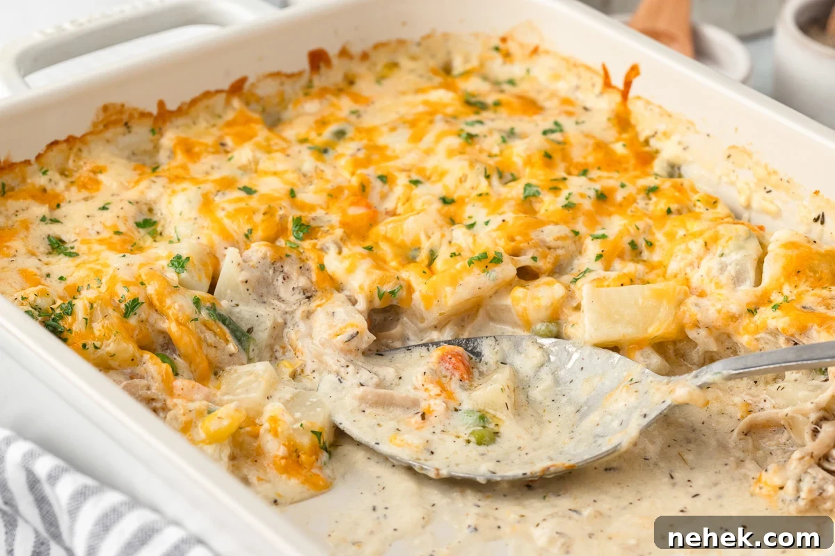 One-Pan Chicken and Potato Casserole with Crispy Top 11 Chicken and potato caserole scooped out of dish.